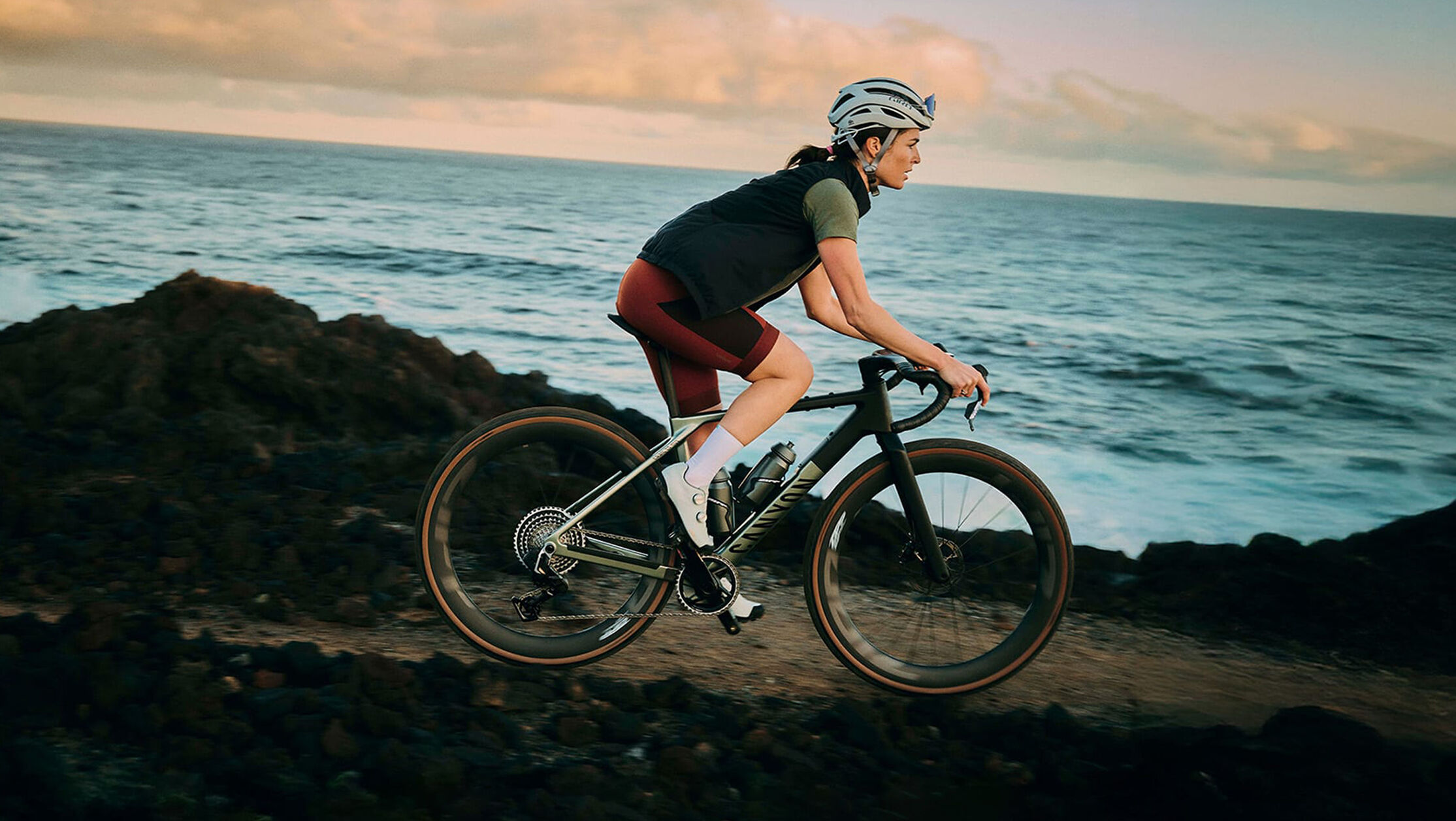 Canyon Grizl gravel bike with bikepacking setup including frame bag and dual water bottles with DT Swiss wheels.